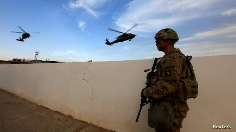 FILE PHOTO: A U.S army soldier stands with his weapon at a military base in the Makhmour area near Mosul during operation to attack Islamic State militants in Mosul