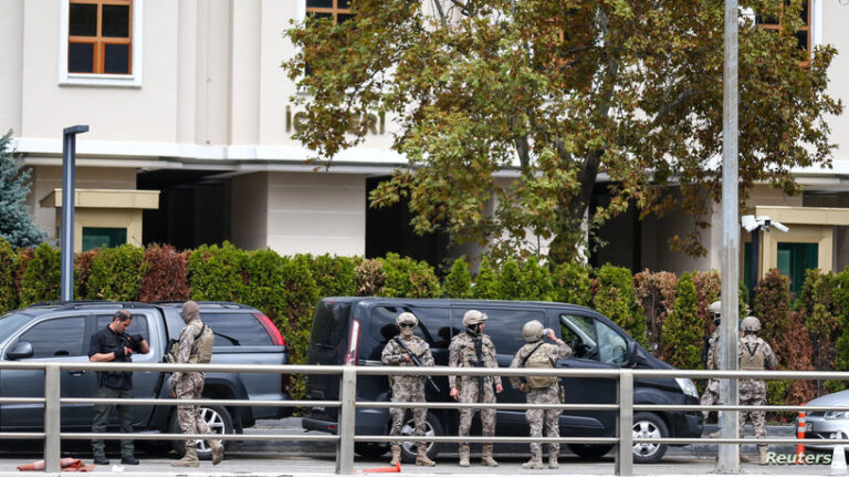 Members of the Turkish Police Special Forces stand guard in front of the Interior Ministry following a bomb attack in Ankara