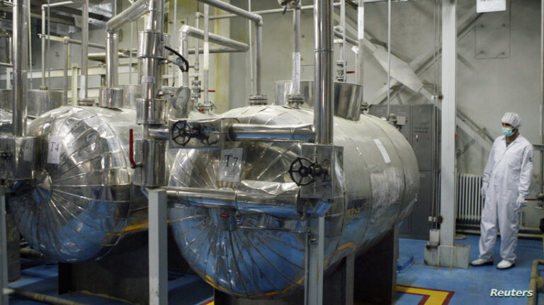 A technician checks valves at the uranium conversian facility in Isfahan