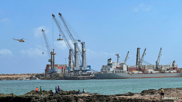 Security helicopters hover above the Mogadishu Sea Port after an Egyptian warship docked to deliver a second major cache of weaponry in Mogadishu