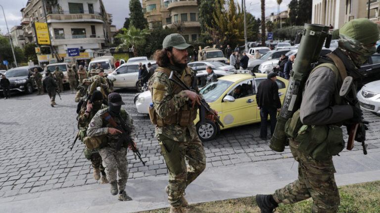 Khaled Brigade, a part of Hay'at Tahrir al-Sham (HTS), hold a military parade, in Damascus