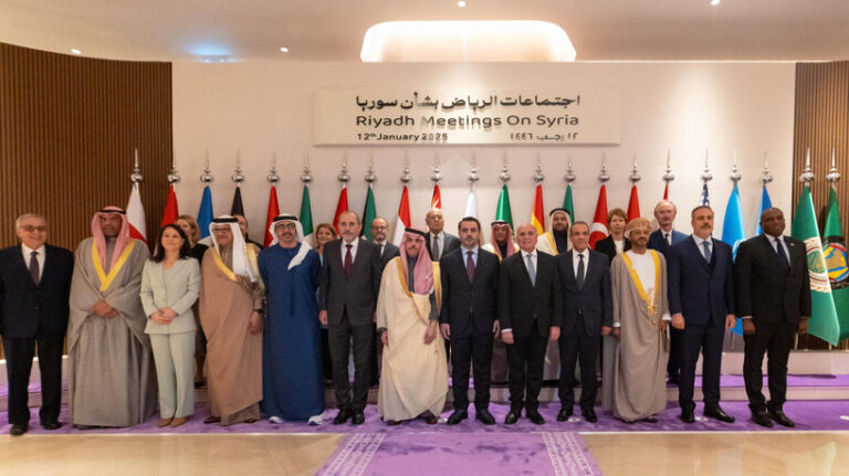 Foreign ministers and delegates pose for a family photo after their meeting on Syria, in Riyadh